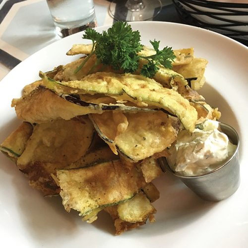 NISI CHIPS EXTRAORDINAIRE: Perfectly thin, crispy fried zucchini and eggplant with tzatziki. Photo by David Porat.