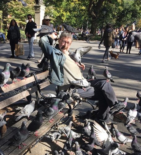 AMONG THE FRIENDLY BIRDS AND SQUIRRELS: Paul the "Birdman" makes regular sojourns to Washington Square Park to commune with the pigeons and other little creatures. Photo by Joy Pape.
