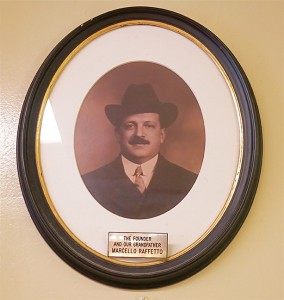 STILL MINDING THE STORE:  Over a hundred years after he opened Raffetto’s, founder Marcello is still a presence, gazing down from his portrait on his creation, his family and their many customers.