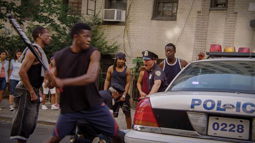 TRADITIONALLY, NEW YORK IS A PLACE WHERE PROVOCATIVE STORIES CAN GET TOLD: The opening scene of Battery Park (a crime series filming in NY) 1997 street riot flashback. Image credit: Mark Wilkinson.